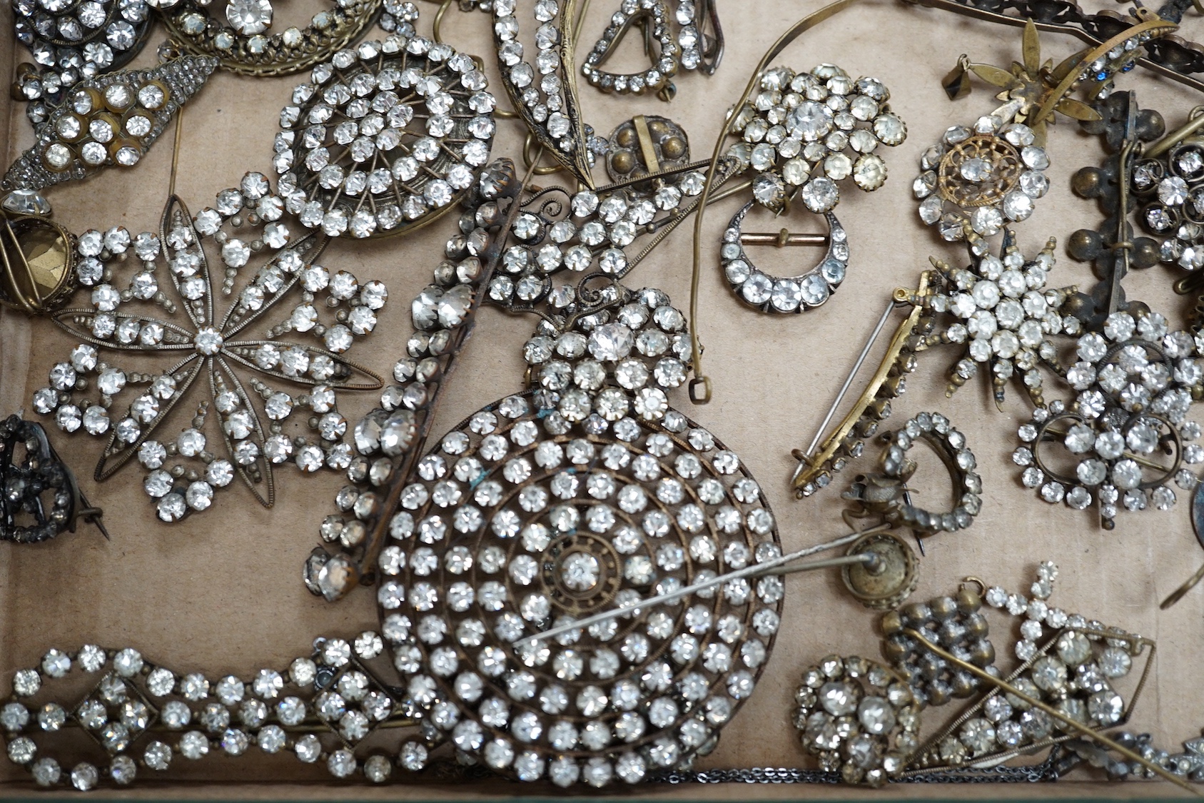 A quantity of assorted white paste jewellery, including brooches, hair ornament, etc.